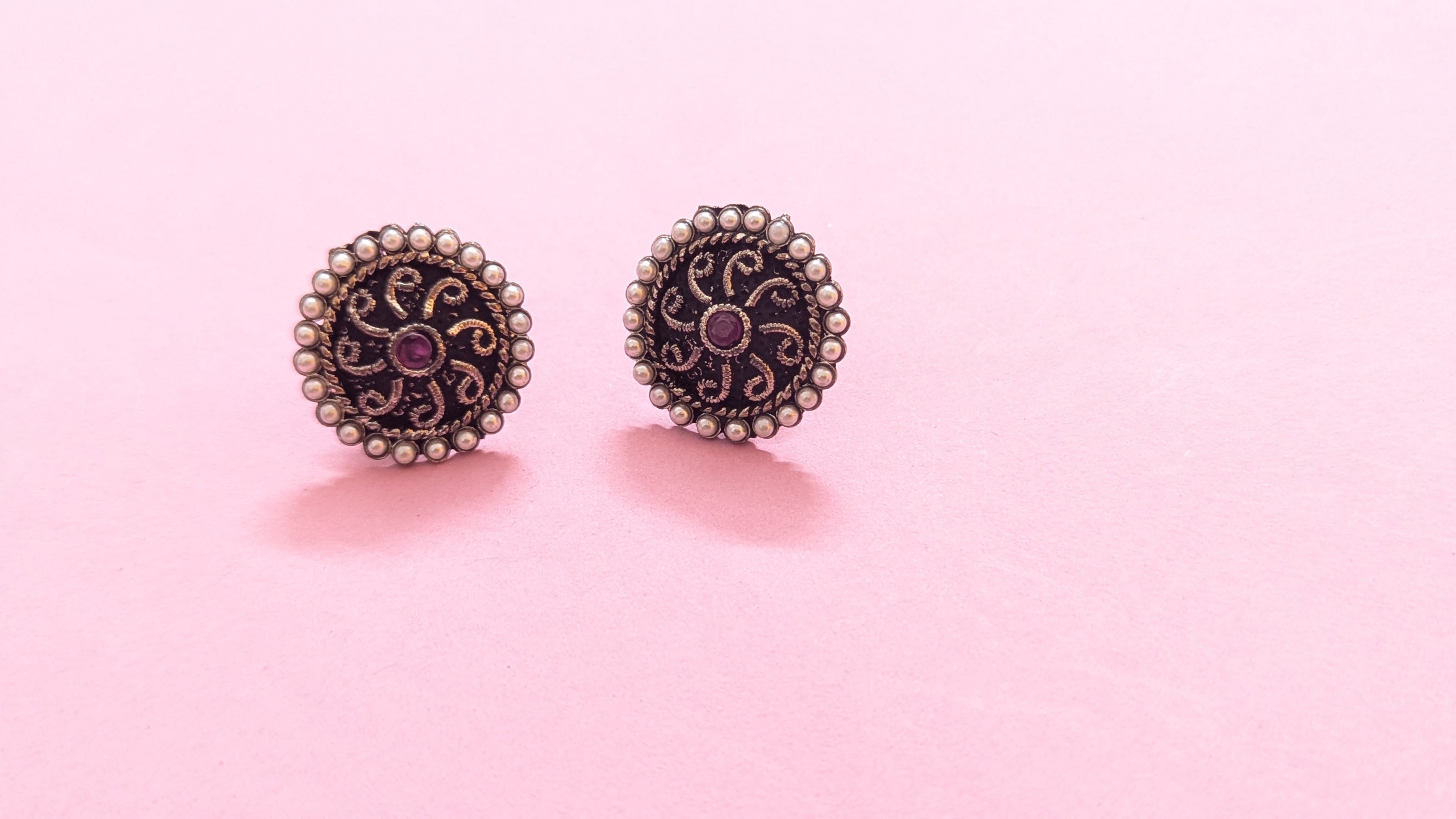 Pearl Studded Round Silver Oxidized Stud Earring With Red Stone In Center