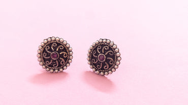 Pearl Studded Round Silver Oxidized Stud Earring With Red Stone In Center