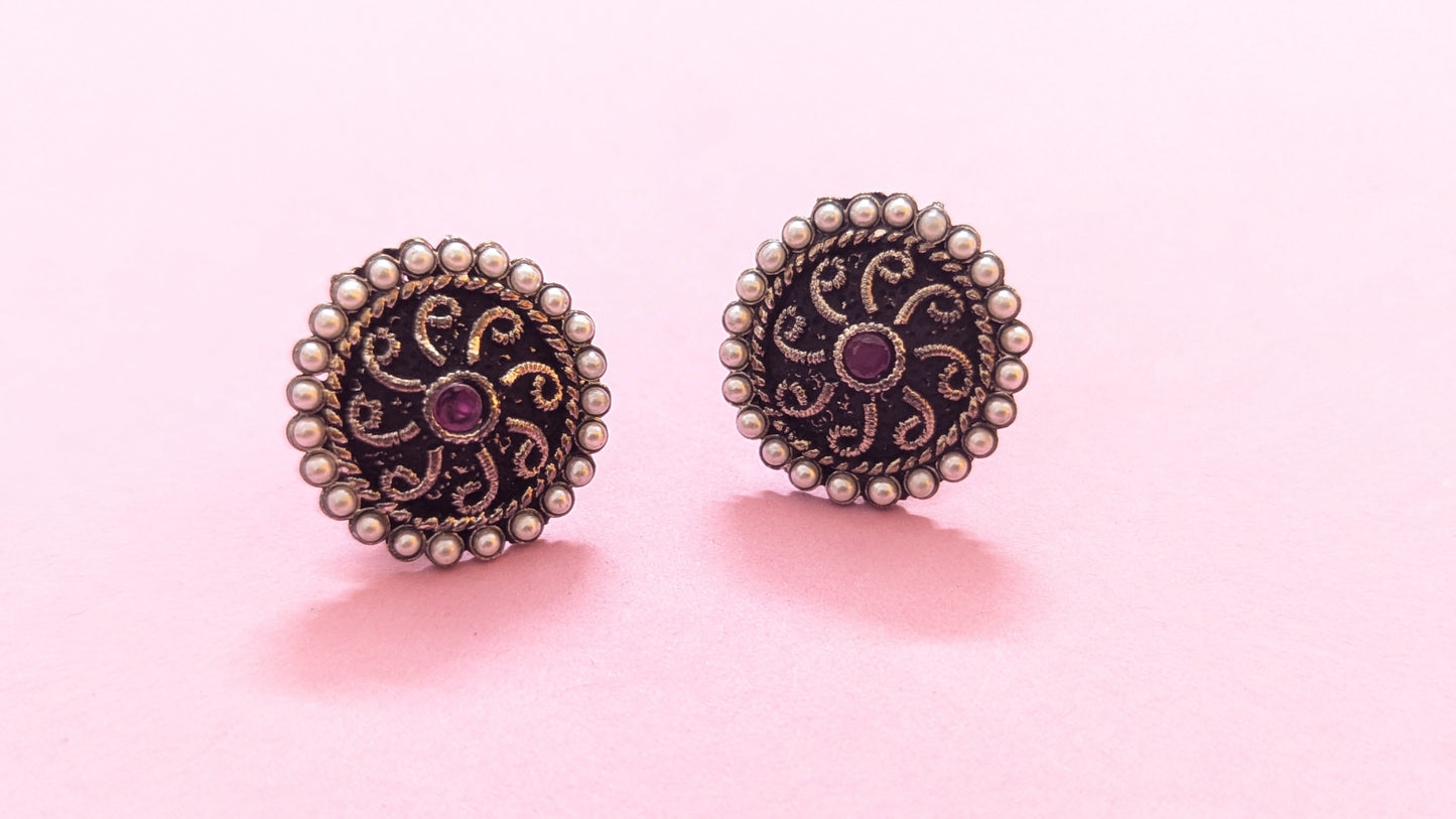 Pearl Studded Round Silver Oxidized Stud Earring With Red Stone In Center