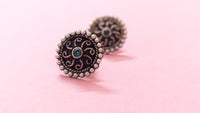 Round Pearl Studded Silver Oxidized Stud Earring With Green Stone In Center