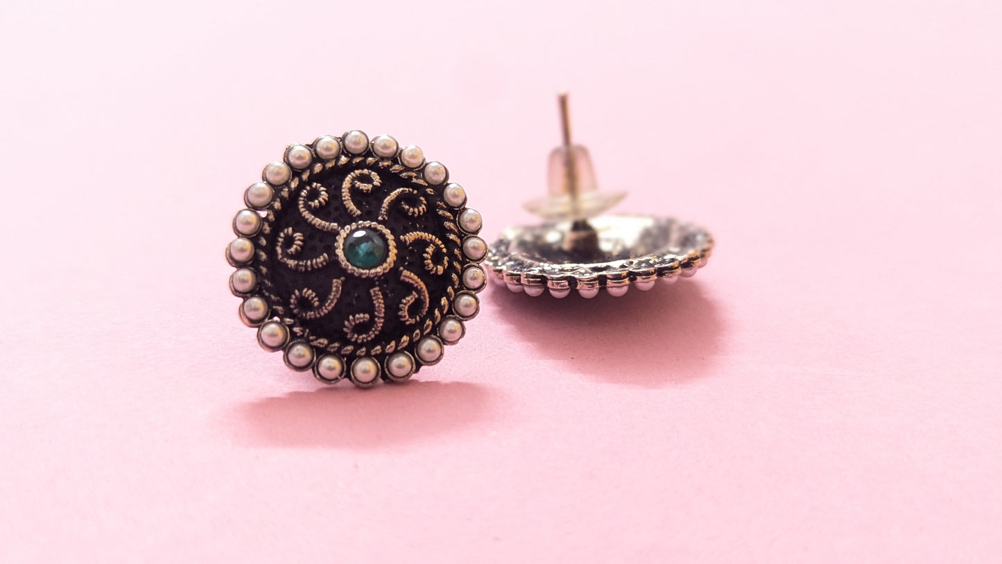 Round Pearl Studded Silver Oxidized Stud Earring With Green Stone In Center